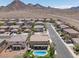 An aerial view of a neighborhood showcasing desert homes and desert landscape at 176 Jay Porter Ave, Henderson, NV 89002