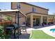 Enjoy outdoor cooking with this grill setup and gazebo, nestled beside the artificial turf and pool at 176 Jay Porter Ave, Henderson, NV 89002