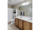Bathroom with double sink vanity, tile floors, shower, and plenty of space at 176 Jay Porter Ave, Henderson, NV 89002