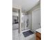 Bathroom featuring a glass-enclosed shower with tile floors and a bath mat at 176 Jay Porter Ave, Henderson, NV 89002