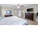 A bright bedroom with natural light includes a bed and a dresser at 176 Jay Porter Ave, Henderson, NV 89002