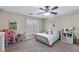 A comfortable bedroom features a ceiling fan and a carpeted floor at 176 Jay Porter Ave, Henderson, NV 89002