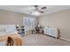 Relaxing bedroom featuring a bed, dresser, ceiling fan, and window at 176 Jay Porter Ave, Henderson, NV 89002