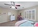 A comfortable bedroom features a ceiling fan and a carpeted floor at 176 Jay Porter Ave, Henderson, NV 89002