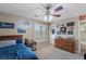 Bedroom featuring a bed, ceiling fan, dresser, and window with white shutters at 176 Jay Porter Ave, Henderson, NV 89002
