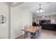 Dining area adjacent to the living room, featuring a wood table with seating for four at 176 Jay Porter Ave, Henderson, NV 89002