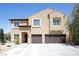 Two-story stucco home boasts a tile roof, two-car garage, and well-maintained landscaping at 176 Jay Porter Ave, Henderson, NV 89002