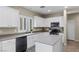 Modern kitchen featuring white cabinets, stainless steel appliances, and plenty of counter space at 176 Jay Porter Ave, Henderson, NV 89002
