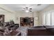 Open living room with leather seating, a large entertainment center, and bright natural light at 176 Jay Porter Ave, Henderson, NV 89002