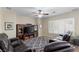 Cozy living room with a large television, comfortable leather recliners, and plantation shutters at 176 Jay Porter Ave, Henderson, NV 89002