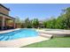 Backyard oasis showcasing a stunning pool, spa, and lush green artificial turf at 176 Jay Porter Ave, Henderson, NV 89002