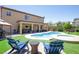 Relax by the sparkling pool and spa, complete with lounge chairs for enjoying sunny days at 176 Jay Porter Ave, Henderson, NV 89002