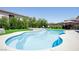 Relaxing pool and spa area surrounded by lush landscaping, and outdoor kitchen for outdoor living at 176 Jay Porter Ave, Henderson, NV 89002