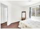 Simple bedroom design with carpet, and a wooden framed mirror at 185 Renville Ct, Henderson, NV 89074