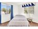 Bedroom with carpet, large windows, and blue curtains at 185 Renville Ct, Henderson, NV 89074