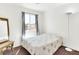Neutral-toned bedroom with a table lamp and carpet floors at 185 Renville Ct, Henderson, NV 89074
