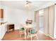 Bright dining area features wood floors, a sliding glass door, and view of backyard at 185 Renville Ct, Henderson, NV 89074