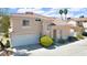 Charming two-story home with tile roof, attached garage, and well-maintained landscaping at 185 Renville Ct, Henderson, NV 89074