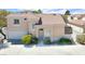 Attractive two-story home featuring a tile roof, attached garage, and manicured landscaping at 185 Renville Ct, Henderson, NV 89074