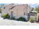 Charming two-story home with a well-manicured front lawn and tile roof at 185 Renville Ct, Henderson, NV 89074