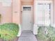 Inviting front entrance with a decorative light fixture and manicured bushes at 185 Renville Ct, Henderson, NV 89074
