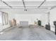 Spacious garage with a concrete floor and ample room for parking and storage at 185 Renville Ct, Henderson, NV 89074