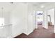 Upstairs hallway with carpet and a view to bedrooms at 185 Renville Ct, Henderson, NV 89074