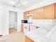 Functional kitchen with white appliances, ample counter space, and tile flooring at 185 Renville Ct, Henderson, NV 89074