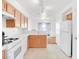 Bright kitchen with white appliances, ample counter space, and tile flooring at 185 Renville Ct, Henderson, NV 89074