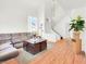 Comfortable living room featuring wood floors, staircase, and lots of natural light at 185 Renville Ct, Henderson, NV 89074