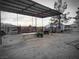 Outdoor barn features a covered area with hay and farm equipment, ready for agricultural endeavors at 1930 N Murphy St, Pahrump, NV 89060