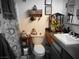 Functional bathroom with sink, toilet, and whimsical decorations at 1930 N Murphy St, Pahrump, NV 89060