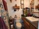 Full bathroom showcasing a toilet and vanity with a decorative shower curtain at 1930 N Murphy St, Pahrump, NV 89060