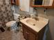 Standard bathroom with vanity cabinet, toilet, and tile floor at 1930 N Murphy St, Pahrump, NV 89060