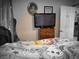 Cozy bedroom featuring a comfortable bed and a dresser at 1930 N Murphy St, Pahrump, NV 89060