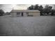 Charming single-story home with neutral stucco exterior and spacious gravel front yard at 1930 N Murphy St, Pahrump, NV 89060