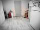 Functional kitchen with white cabinetry, ample space, and convenient access to the door at 1930 N Murphy St, Pahrump, NV 89060