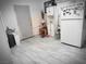 Functional kitchen with white cabinetry, wood accents, and modern refrigerator at 1930 N Murphy St, Pahrump, NV 89060