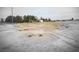 Large lot with storage buildings and tire tracks, desert landscape at 1930 N Murphy St, Pahrump, NV 89060