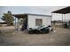 Outbuilding featuring covered area and parking for a motorcycle, providing functional space at 1930 N Murphy St, Pahrump, NV 89060