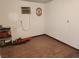 Room with wood-look flooring and an air conditioner, offering functional, simple living at 1930 N Murphy St, Pahrump, NV 89060