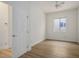 Bright, empty bedroom featuring wood-look flooring and a window at 1978 Kachina Mountain Dr, Henderson, NV 89012