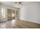 Spacious bedroom with a sliding door to the outdoors and wood-look floors at 1978 Kachina Mountain Dr, Henderson, NV 89012