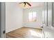 Sunlit bedroom with light vinyl floors, ceiling fan and a window at 1978 Kachina Mountain Dr, Henderson, NV 89012
