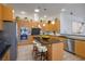 Bright kitchen with a central island, stainless appliances, and modern lighting at 1978 Kachina Mountain Dr, Henderson, NV 89012