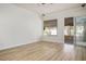 Bright living room boasts wood-look floors, and slider doors to the outdoors at 1978 Kachina Mountain Dr, Henderson, NV 89012