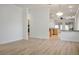 Spacious living room with light wood floors and contemporary lighting fixtures at 1978 Kachina Mountain Dr, Henderson, NV 89012