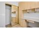 A home office featuring custom built-in storage cabinets and a large workspace at 1978 Kachina Mountain Dr, Henderson, NV 89012