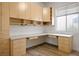 A home office featuring custom built-in storage cabinets and a large workspace at 1978 Kachina Mountain Dr, Henderson, NV 89012