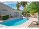 Inviting backyard pool with sparkling water, lush landscaping, and a fun unicorn float at 1978 Kachina Mountain Dr, Henderson, NV 89012